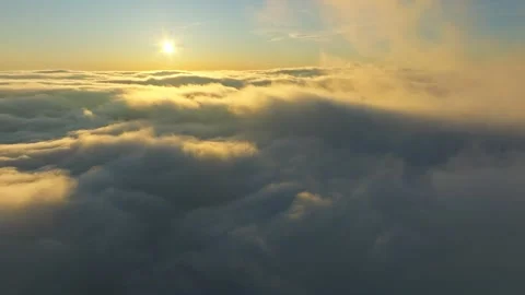 Sunrise illuminates broad skyscape, Daybreak reveals vast cloud formations Stock Footage 324611178