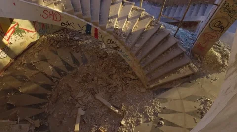 Sunrise inside an abandoned building staircase  paintings graffiti gimbal 4k Stock Footage 67355499