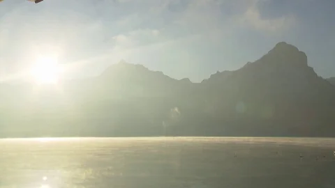 Sunrise at a lake in the mountains Stock Footage 71100370