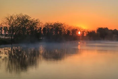Sunrise on the lake Stock Photos