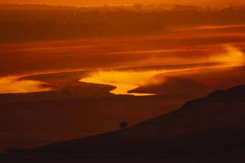 Sunrise landscape, colorful warm cold nature, world, river, hills and village Stock Photos