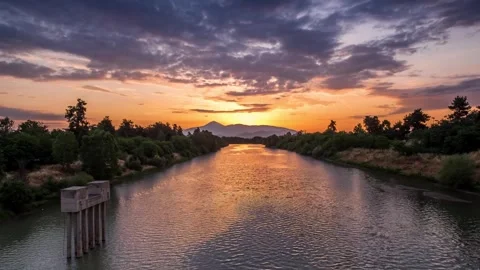 Sunrise landscape timelapse over a river Stock Footage 242582096