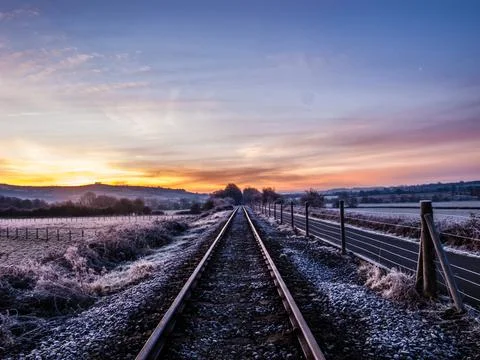 Sunrise light and perspective view on cycle path overlooking English countryside Stock Photos
