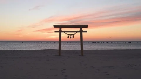 Sunrise light and Torii gate at the beach, Shizuoka, Japan Stock Footage 325833505