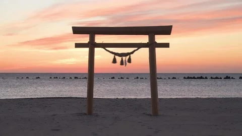 Sunrise light and Torii gate at the beach, Shizuoka, Japan Stock Footage 325833514