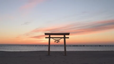 Sunrise light and Torii gate at the beach, Shizuoka, Japan Stock Footage 325833520