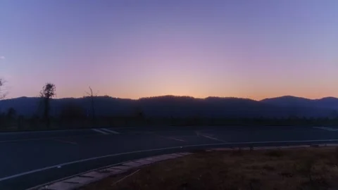 Sunrise Light Over Mountain Road Timelapse Stock Footage 326702041