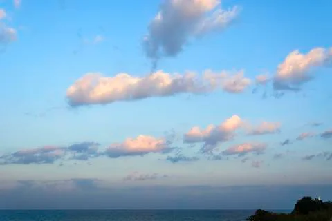 Sunrise lighthouse on cliff Stock Photos