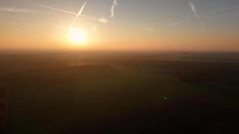 Sunrise Lights Over Vast Fields, Bright Sunrise With Vapor Trails Over Wide Stock Footage 328049409