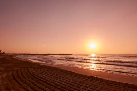 Sunrise on lonely beach, Stock Photos