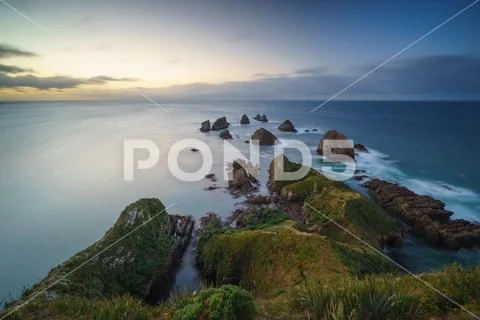 Sunrise From Lookout Point at Nugget Point Lighthouse, Caitlins, Otago, New.. Stock Photos