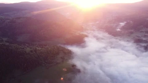 Sunrise , misty a cloud inversion in a rural valley in mountain rural landscape Video stock 196986899
