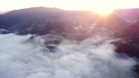 Sunrise , misty a cloud inversion in a rural valley in mountain rural landscape Stock Footage 201129522