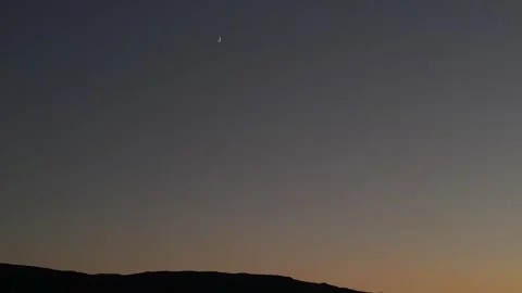 Sunrise with Moon located between Reno, NV and Fallen, NV Stock Footage 253804898