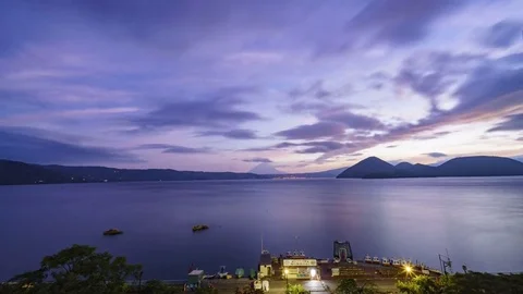 Sunrise motion timelapse of the famous Lake Toya with Mount Yotei Stock Footage