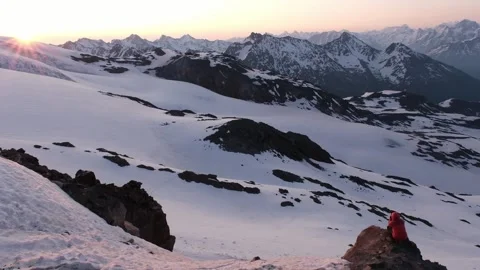Sunrise on Mount Elbrus, view of the Observatory and mountains from the slope of Stock Footage 340610935