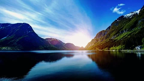Sunrise mountain lake, dramatic nature view, tranquil fjord morning Video stock 310594255