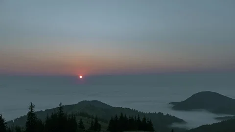 Sunrise in the mountains above the clouds Stock Footage 94602439