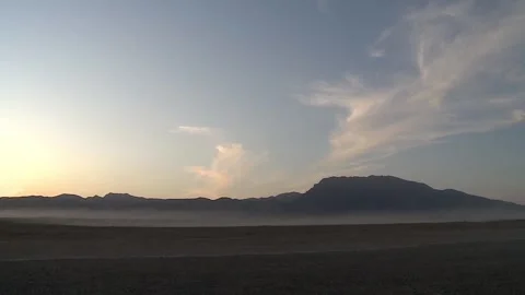 Sunrise in the mountains, clouds slowly floating over the mountain tops, morning Stock Footage 119288893