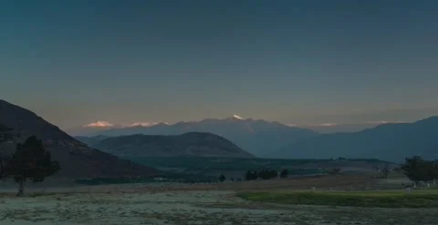 Sunrise, mountains, greenery, sunbeam, clouds, snowmountain, Timelapse Stock Footage 247132662