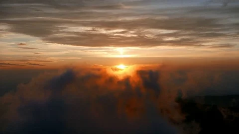 Sunrise in the mountains with misty clouds moving. Stock Footage 80867787