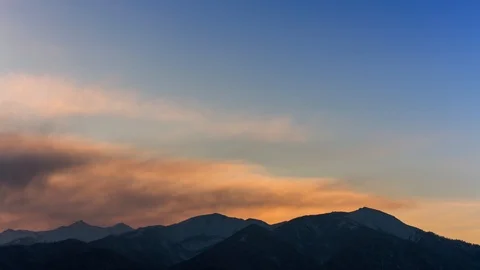 Sunrise in the mountains, moving clouds Stock-Footage 106096920