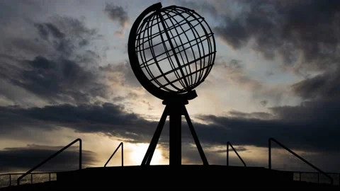 Sunrise at North Cape, Time Lapse with Fast Clouds and Dark Silhouette of Globe Stock Footage 164707514