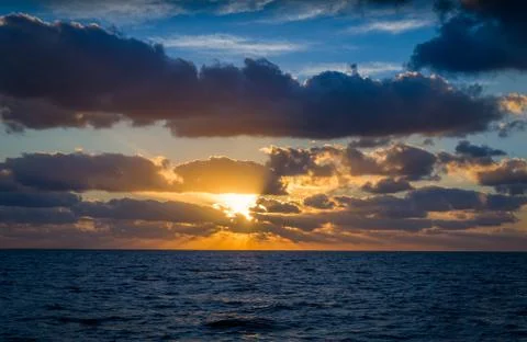 Sunrise at ocean Stock Photos