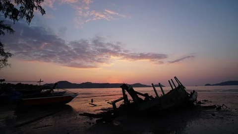 Sunrise with old boat Stock Footage 102018591