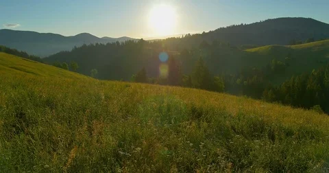 Sunrise or sunset in the mountains. Forest in the mountains. Panorama Beautiful Stock Footage 77263680
