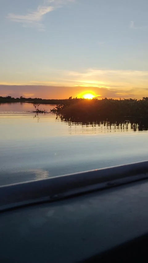Sunrise or sunset over Cuiabá River in Pantanal, seen from a boat Stock Footage 310208581