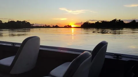 Sunrise or sunset timelapse over Cuiabá River with lush reflections in Pantanal Stock Footage 310208632