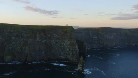 Sunrise Orbit of Cliffs of Moher, O'Brien's Tower and Sea Stack in View Stock Footage 291407377