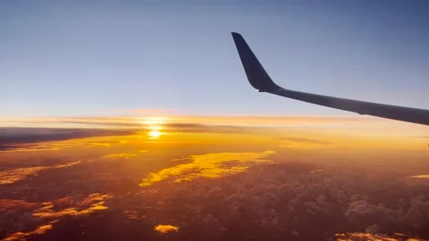 Sunrise Out of An Airplane Window Includes Airplane Wing Stock Footage 229273757