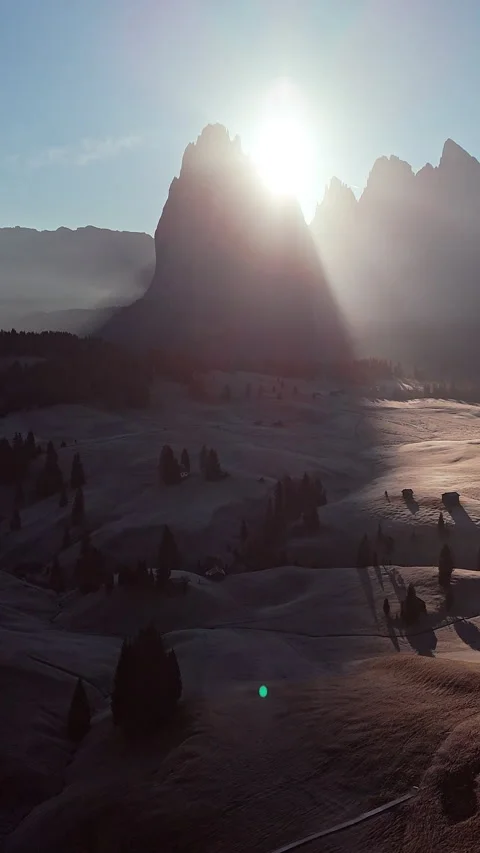 Sunrise Over Alpine Meadows with Silhouetted Peaks in Trentino 動画素材 334774564