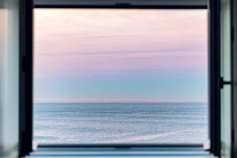Sunrise over Atlantic Ocean through the open window Stock Photos