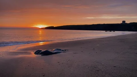 Sunrise over baginbun head Stock Footage 144782437