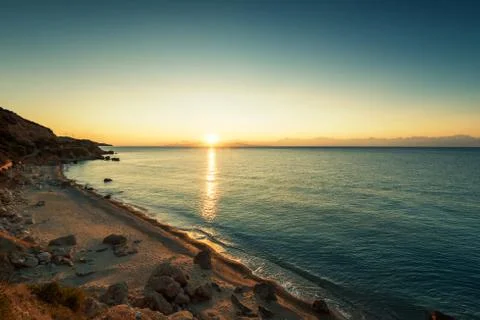 Sunrise over beach in Greece. Stock Photos