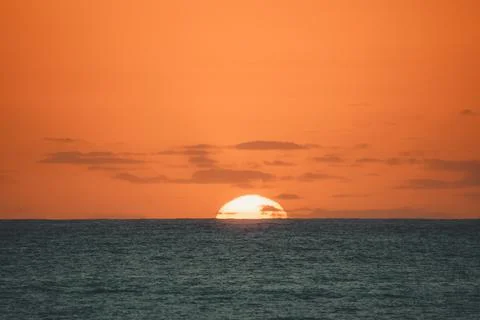A sunrise over a beach. Stock Photos