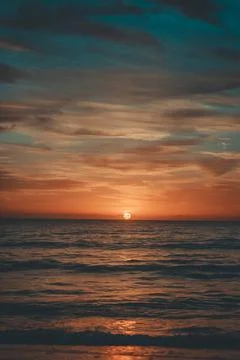 A sunrise over a beach. Stock-Fotos