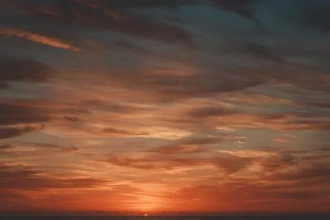 A sunrise over a beach. Stock Photos