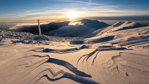 Sunrise over beautiful snow structure in frozen winter alps mountains nature Stock Footage 230508010