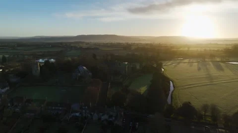 Sunrise over Berkeley Castle from a drone, Berkeley, Cotswolds, Gloucestershire Stock Footage 302310797