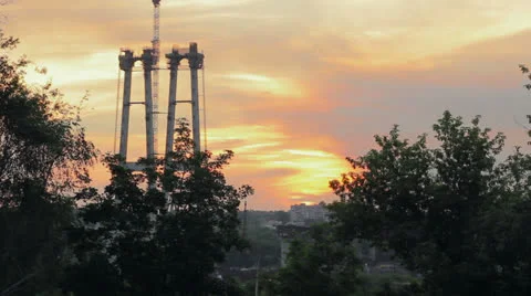 Sunrise over bridge construction timelapse Stock Footage 24710194