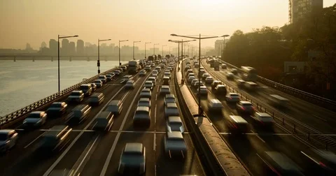 Sunrise over busy expressway Stock Footage 83309692