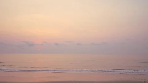 Sunrise over a calm ocean Stock Footage 74255976
