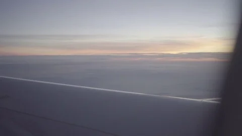 Sunrise over clouded hills seen from plane slog2 Stock-Footage 82448299
