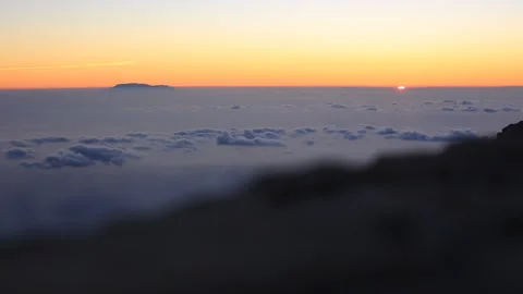 Sunrise over the clouds in the mountains Stock Footage 108694753