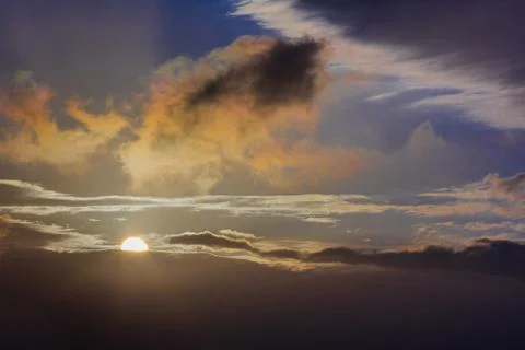Sunrise over the clouds Stock Photos