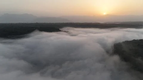 Sunrise over clouds Stock Photos